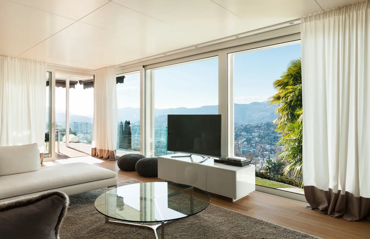 Modern living room with panoramic city view.