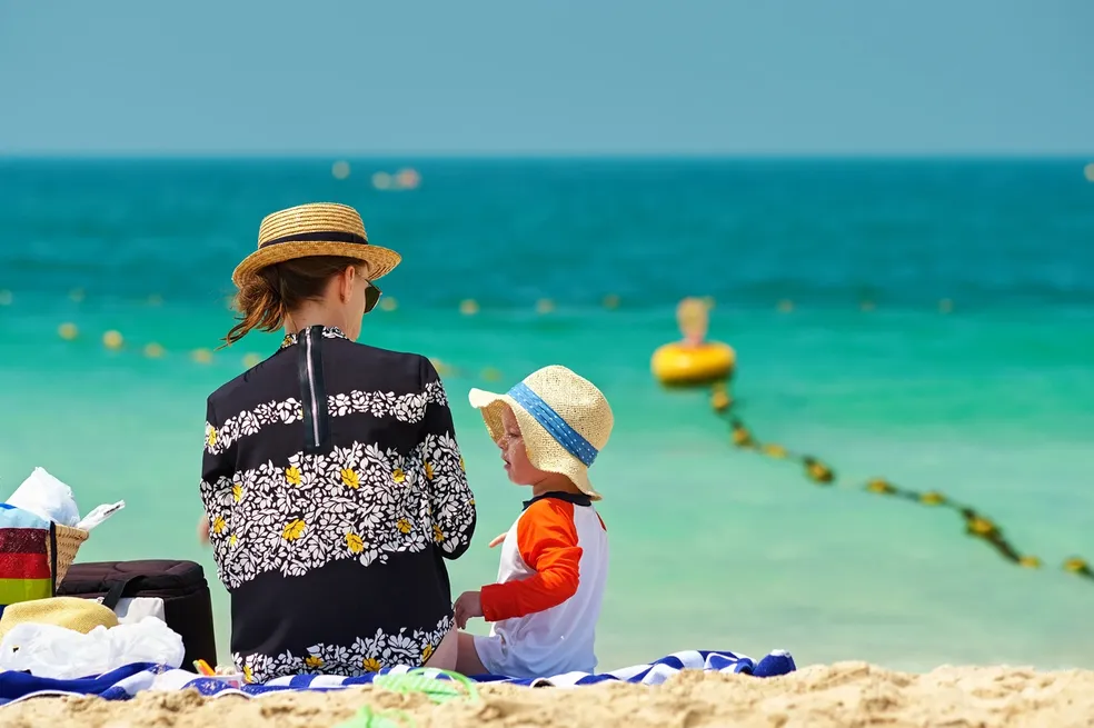 Family enjoying sunny beach day