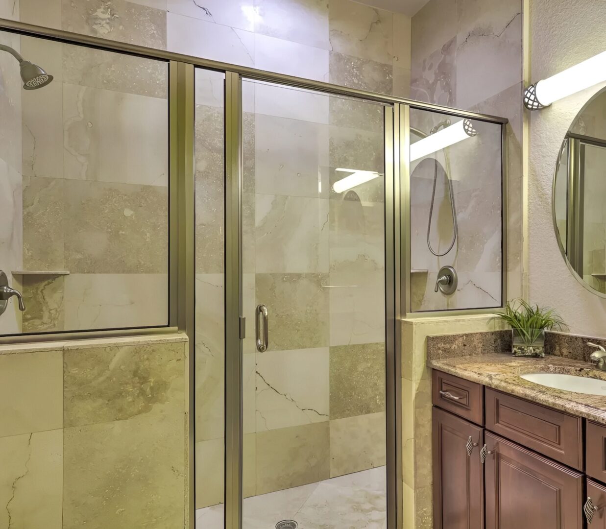 Contemporary bathroom featuring wooden vanity and mirror